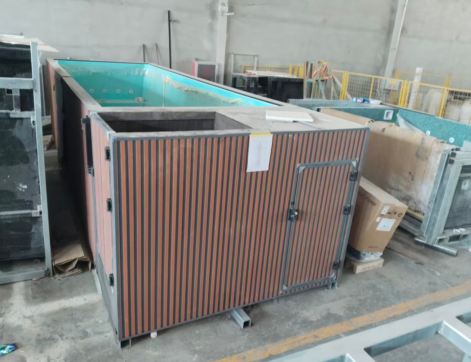 20ft pool with aqua shell and WPC exterior — factory photograph